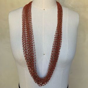 Rope necklace with red bead and brass